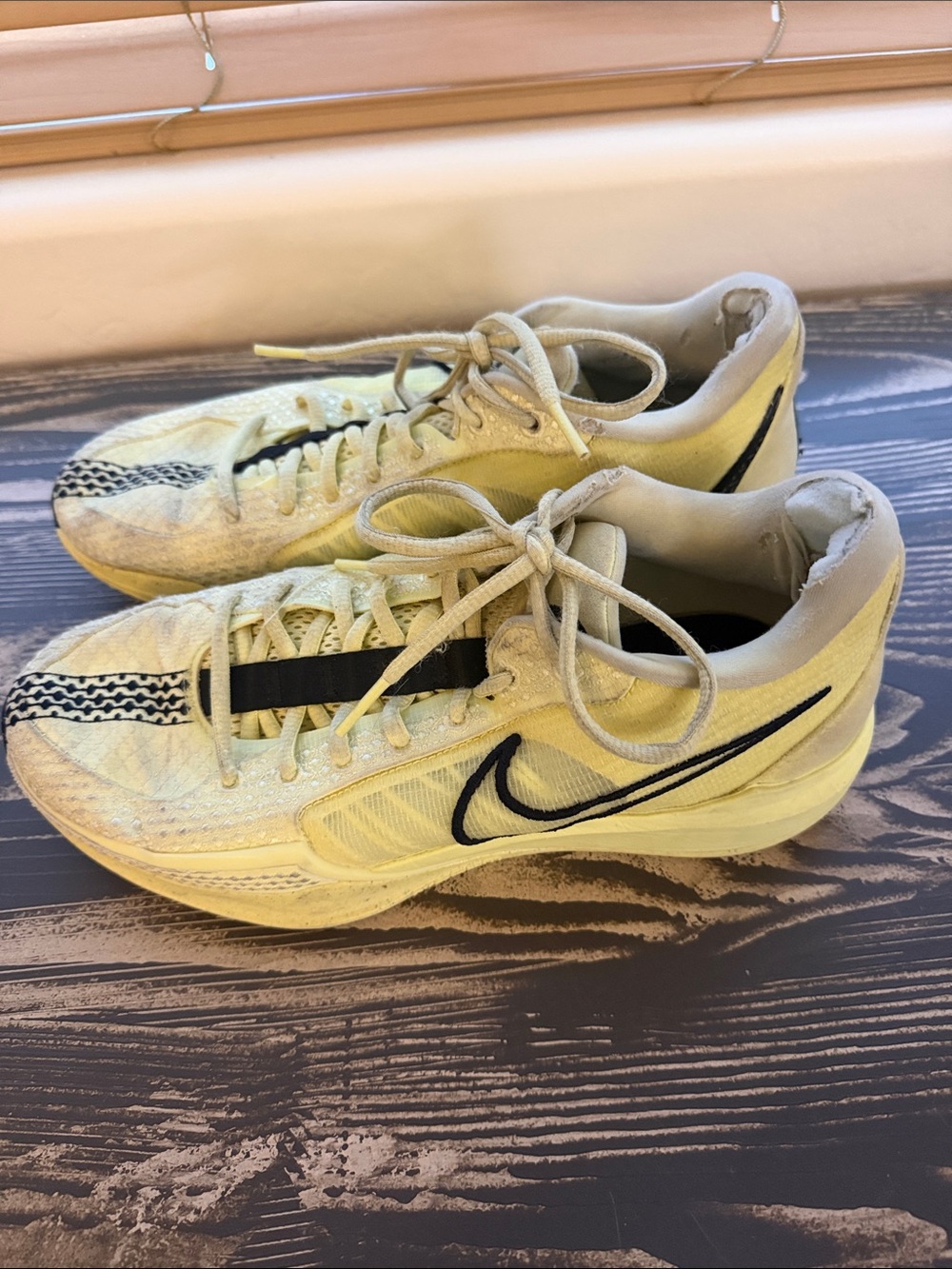 Nike Pale Yellow Sneakers with Black Swoosh